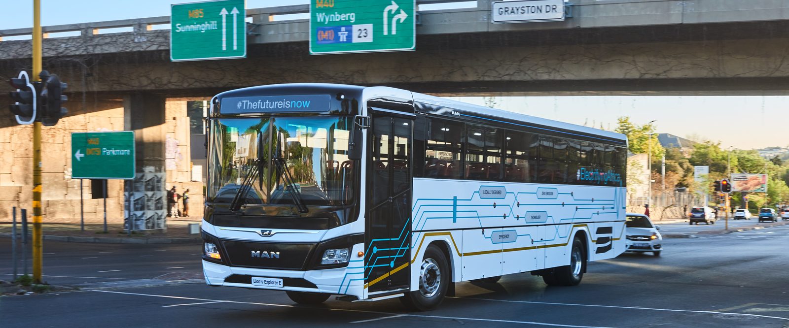 MAN Lion's Explorer E electric bus driving through the city